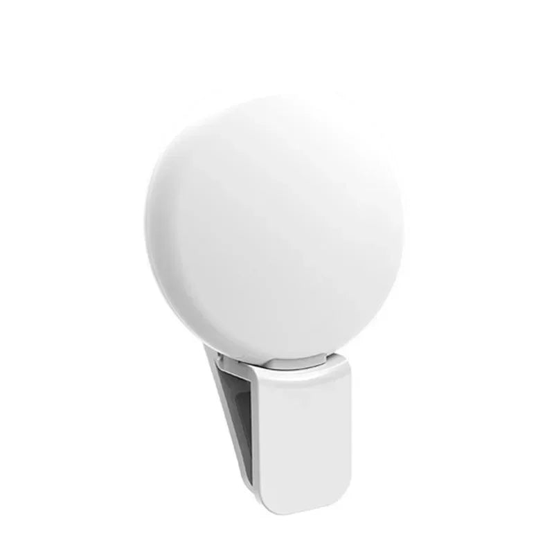 A white portable LED selfie ring light with a clip attached.