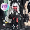 A detailed vinyl art figure of a female character with white hair, red eyes, and black gothic clothing and horns.