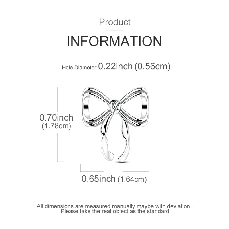 A silver charm bead shaped like a bow, with a hole diameter of 0.22 inches.