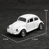 A white 1:38 die-cast model of a classic Beetle car shown from the side.