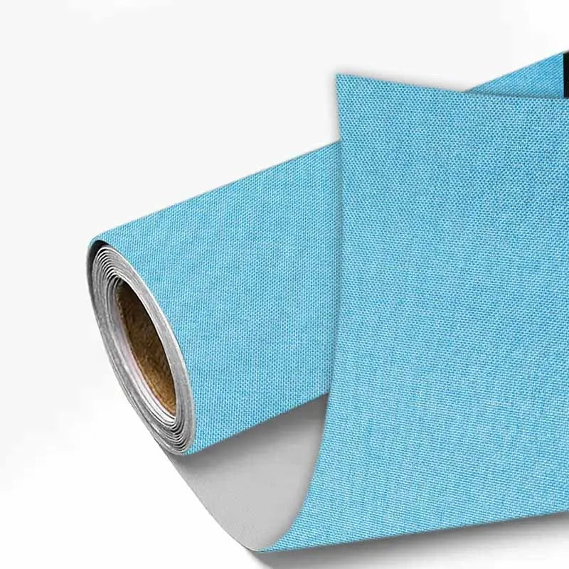 A roll of light blue linen book binding cloth used for albums and scrapbooks.