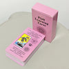 A pink box for a Pink Learning Tarot deck with a card showing The Fool