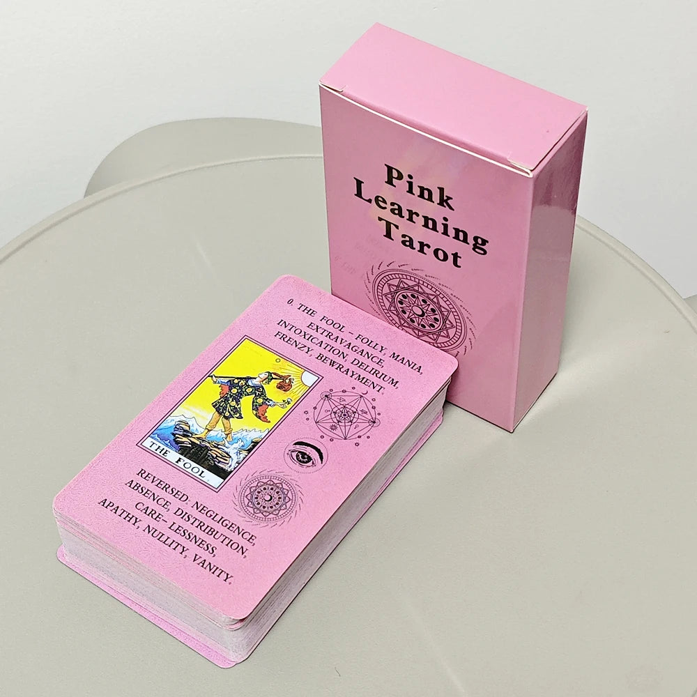 A pink box for a Pink Learning Tarot deck with a card showing The Fool