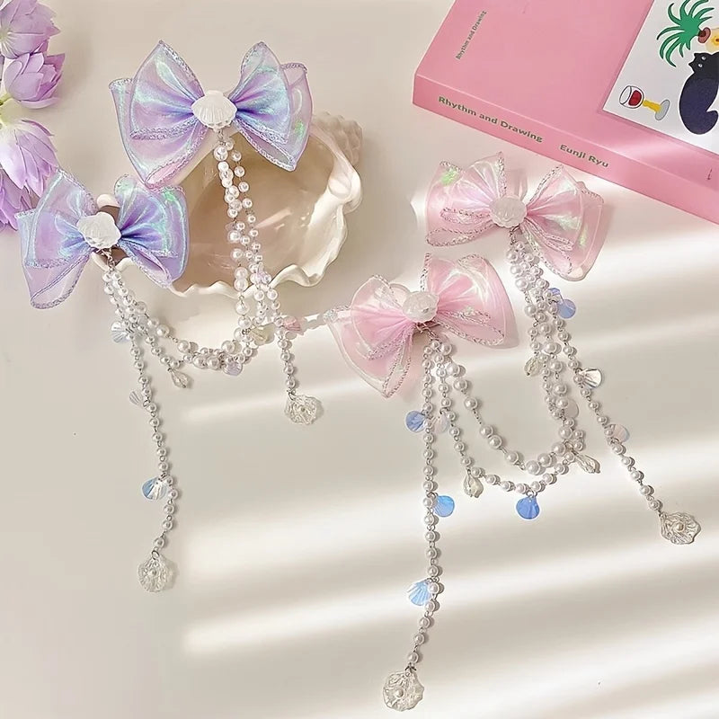 Pink and purple pearl butterfly hair clips with dangling chains for girls