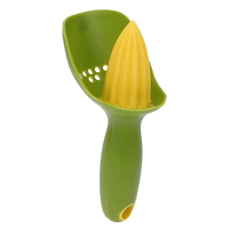 A green manual citrus juicer with a yellow citrus fruit inside.
