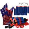 A set of superhero web shooter gloves and a red foam blaster toy.
