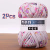 Two skeins of soft chunky t-shirt yarn in lilac and pink floral patterns for crochet and knitting