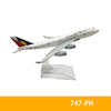 A white diecast model of a Philippine Airlines airplane in flight.