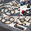 A play mat featuring a city road map design with various miniature cars and a Go race track.