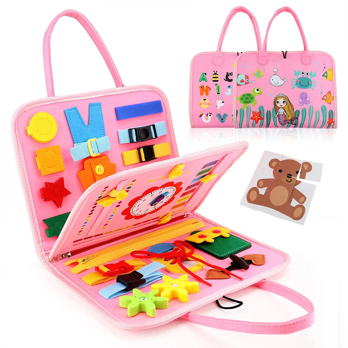 A pink Montessori busy board for toddlers featuring various colorful manipulative items and a matching tote bag.