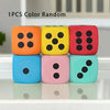 Three jumbo soft foam dice in orange, yellow, and red colors are displayed on a white surface.