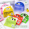 A collection of pearlescent clear sticky notes in various colors and a blue dispenser are displayed on a white surface.