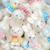 A collection of white and pink Miffy 3D resin bead phone charms and keychains.