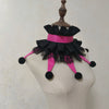 Black and pink ruffled clown ruff collar accessory displayed on a mannequin neck.