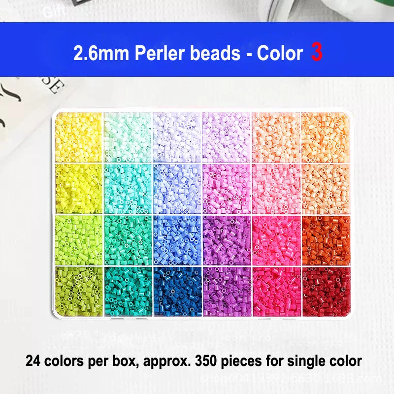 A grid display of 24 colors of 2.6mm perler beads for craft projects.