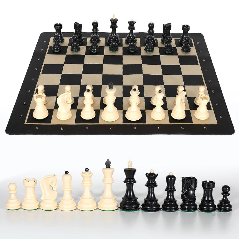 A portable folding chess set with weighted black and white pieces displayed on a chessboard.