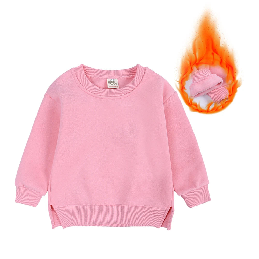 Pink kids pullover hoodie with a hood and a fluffy orange pom-pom