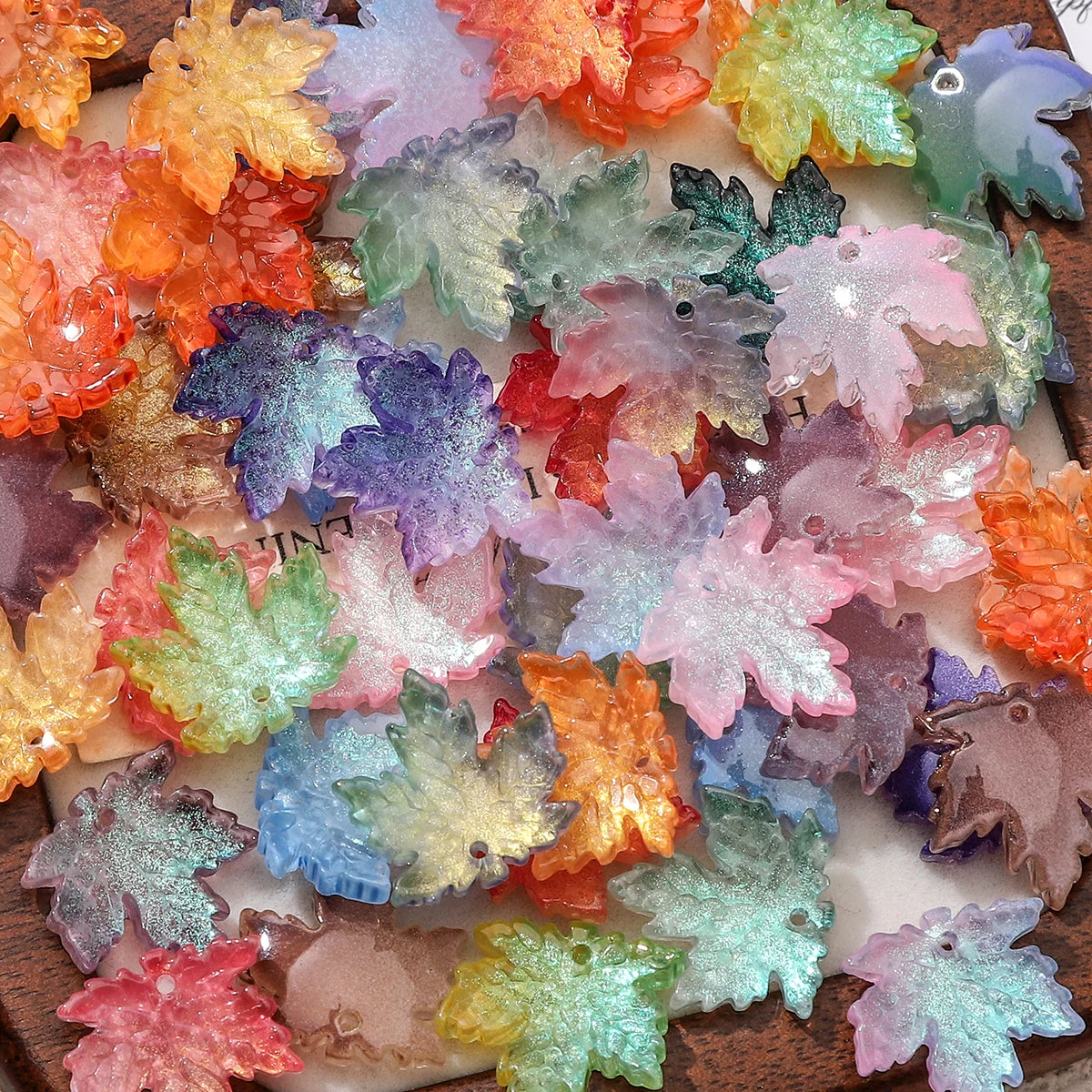 A collection of colorful maple leaf glass beads for DIY jewelry making