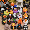 A collection of rubber ducks shaped like various Halloween pumpkins and animals in black, yellow, orange, and purple colors.