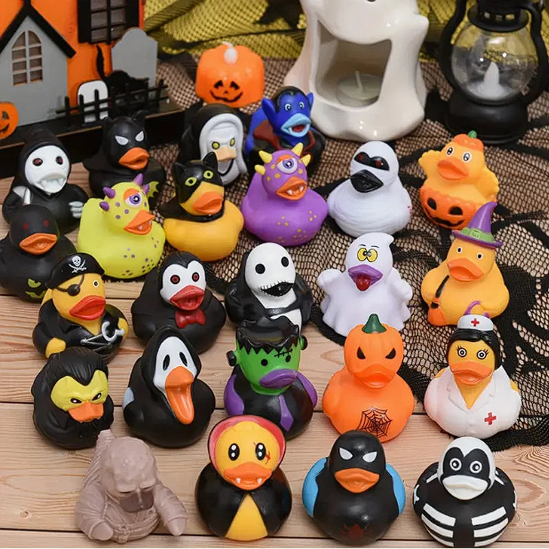 A collection of rubber ducks shaped like various Halloween pumpkins and animals in black, yellow, orange, and purple colors.