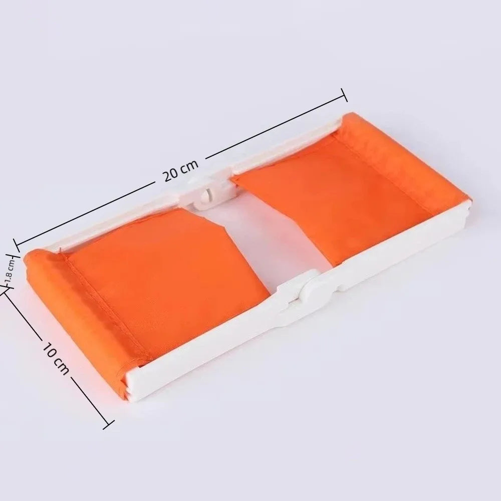 Orange foldable camp pillow with white trim shown from above, indicating its dimensions.