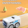 A white Mini Bus toy is shown on a track, with a hand gesture controlling it.