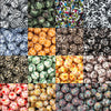 A collection of various printed silicone beads featuring leopard print and daisy patterns in multiple colors.