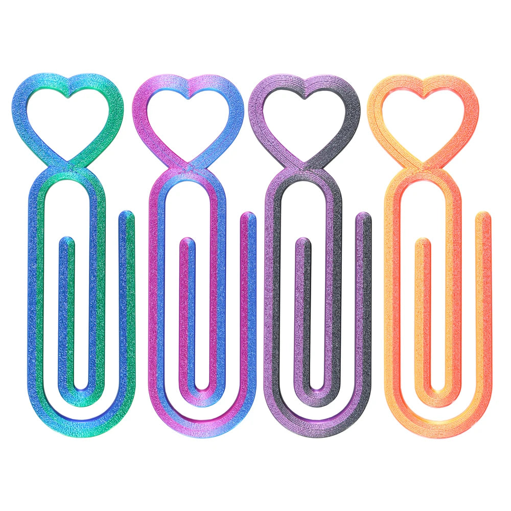 A set of four heart-shaped diamond painting canvas clips in various pastel colors including blue, purple, gray, and orange.