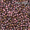 A close-up view of 340 golden gradient glass beads used for DIY jewelry making.