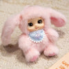 A soft pink plush pendant shaped like an animal face, featuring rabbit, bear, and sheep designs.