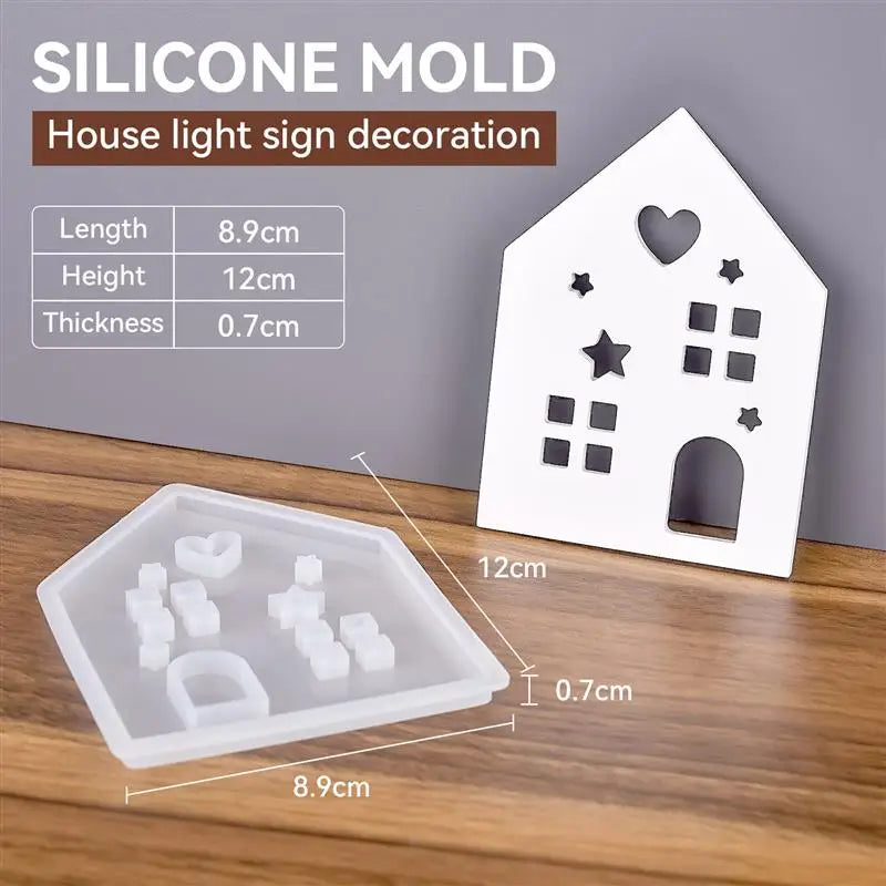A white silicone mold for a house light sign decoration, showing various decorative shapes like hearts and stars.