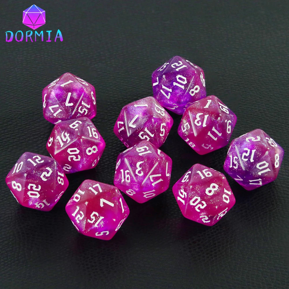 A collection of ten glitter polyhedral dice in various shades of purple and pink resting on a dark surface.