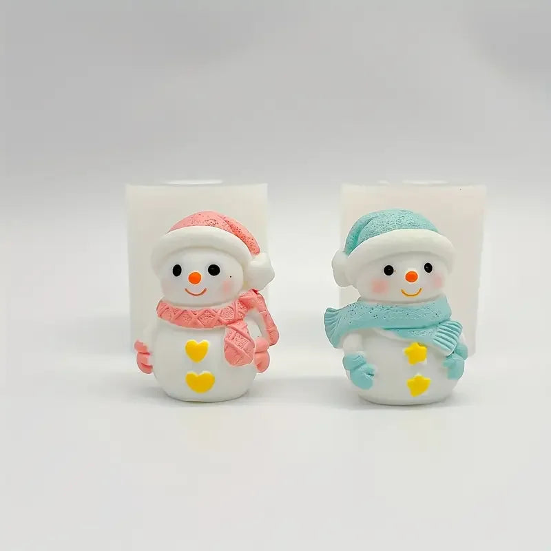 Two cute silicone snowman molds for crafts, one pink and one blue, displayed against a white background.