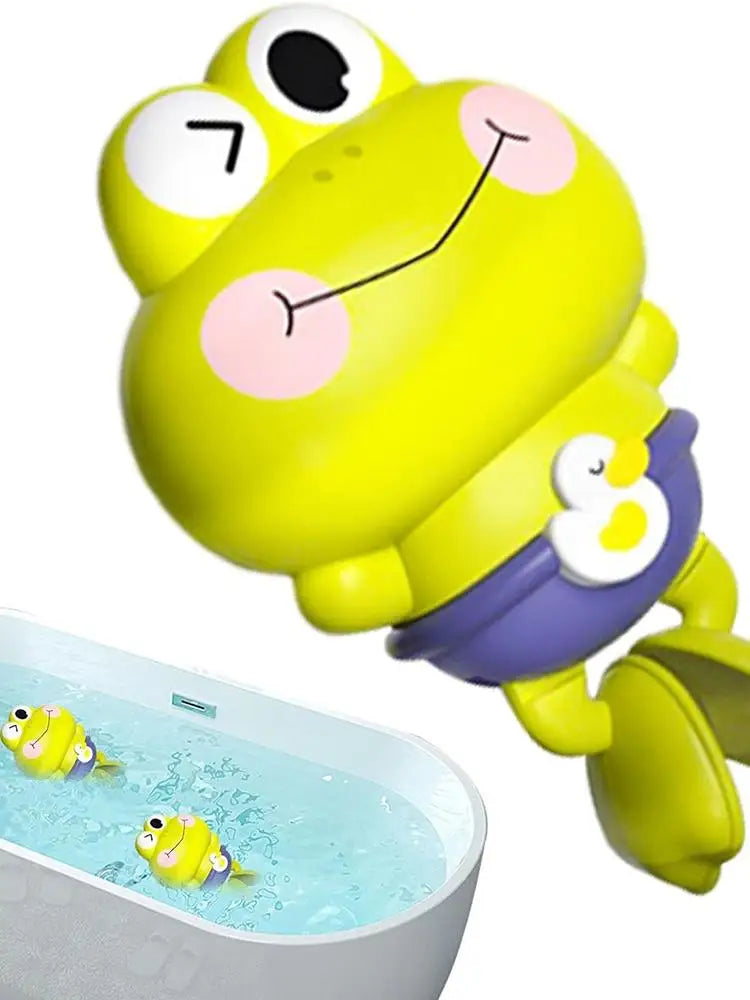 A yellow frog toy with a smiling face is floating in a clear bath container.