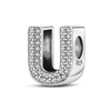 A sterling silver alphabet charm shaped like the letter U, encrusted with cubic zirconia stones.