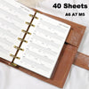 A brown leather notebook with 40 sheets of habit tracker refill pages for A6, A7, and M5 planners.
