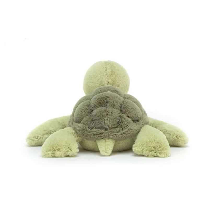 A soft, light green simulated turtle plush doll with a gray head and body.