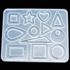 A silicone mold tray containing various geometric shapes like squares, stars, hearts, triangles, and circles for resin castin