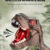 Gros plan d'un jouet de rugissement de dinosaure avec la bouche grande ouverte, émettant une lumière rouge.