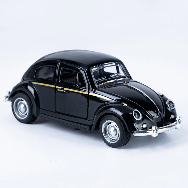 A black die-cast miniature of a classic retro Beetle car with gold accents.