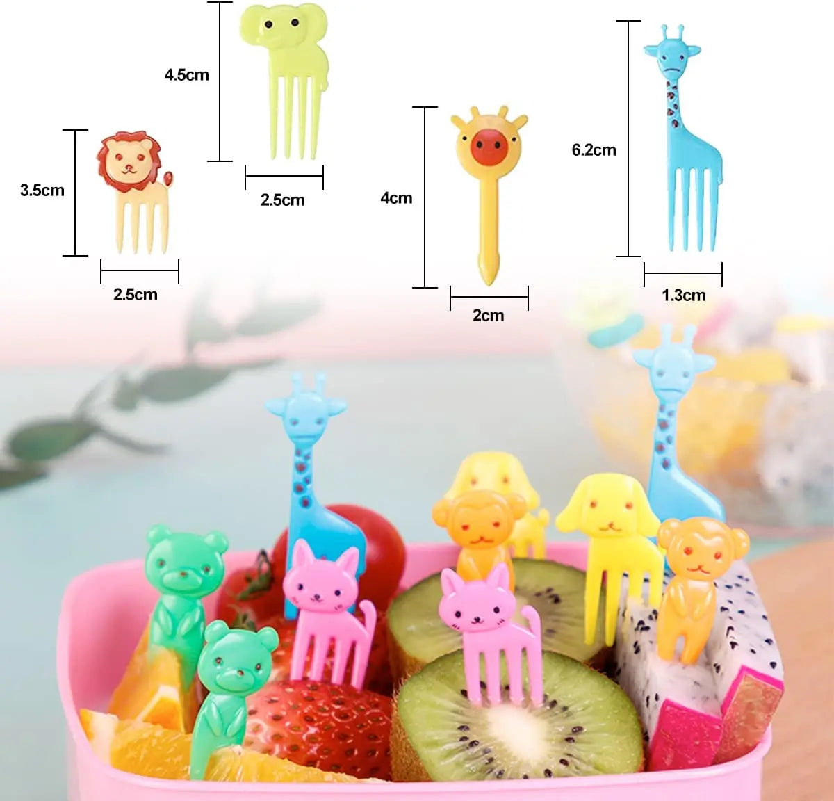 A set of kawaii mini fruit forks in various colors and shapes, including a giraffe, lion, and cat, displayed on a pink plate 