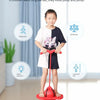 A child is jumping on a red bouncing ball trainer for balance and coordination exercise.
