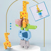 A wooden giraffe stacking block is shown next to shape matching cards on a light blue background.
