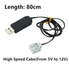 A black cable with a USB connector and a yellow wire is shown next to a small electronic component.