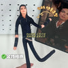 A dark plushie resembling a male figure, possibly inspired by Michael Jackson, is held up against a background featuring a ph