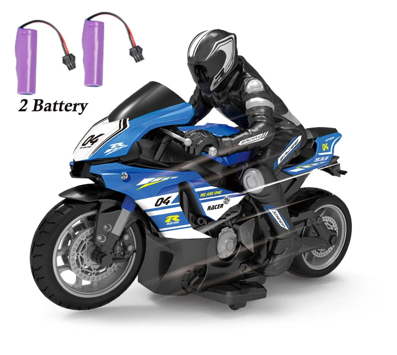 A black and blue 1:10 scale remote control stunt motorcycle with two batteries is shown.
