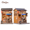 A detailed 3D wooden book nook kit featuring a traditional Japanese shop facade with LED lighting.