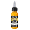 A small amber glass bottle of golden yellow tattoo ink with a dropper cap and a black label.