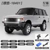 A silver 1:18 scale RC crawler truck is shown in a side view, ready to run.