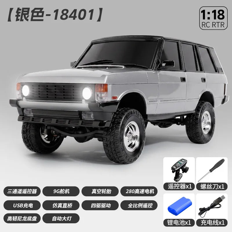 A silver 1:18 scale RC crawler truck is shown in a side view, ready to run.